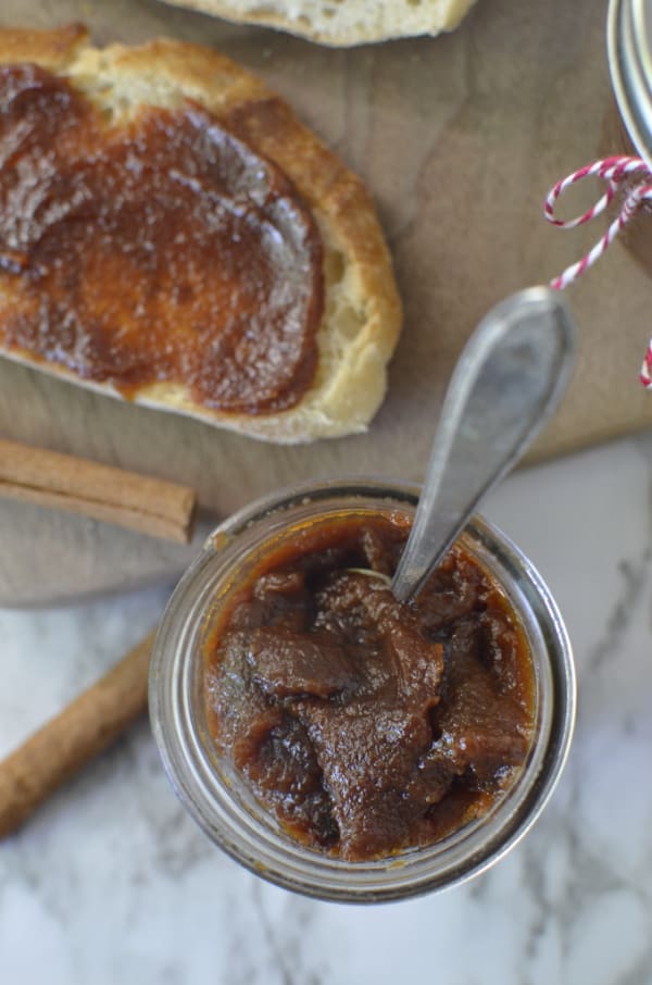 Jar of pear butter with a spoon
