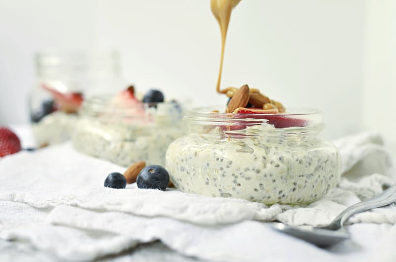 drizzling <span style='background-color:none;'>peanut butter</span><span style='background-color:none;'> </span>on healthy overnight oats