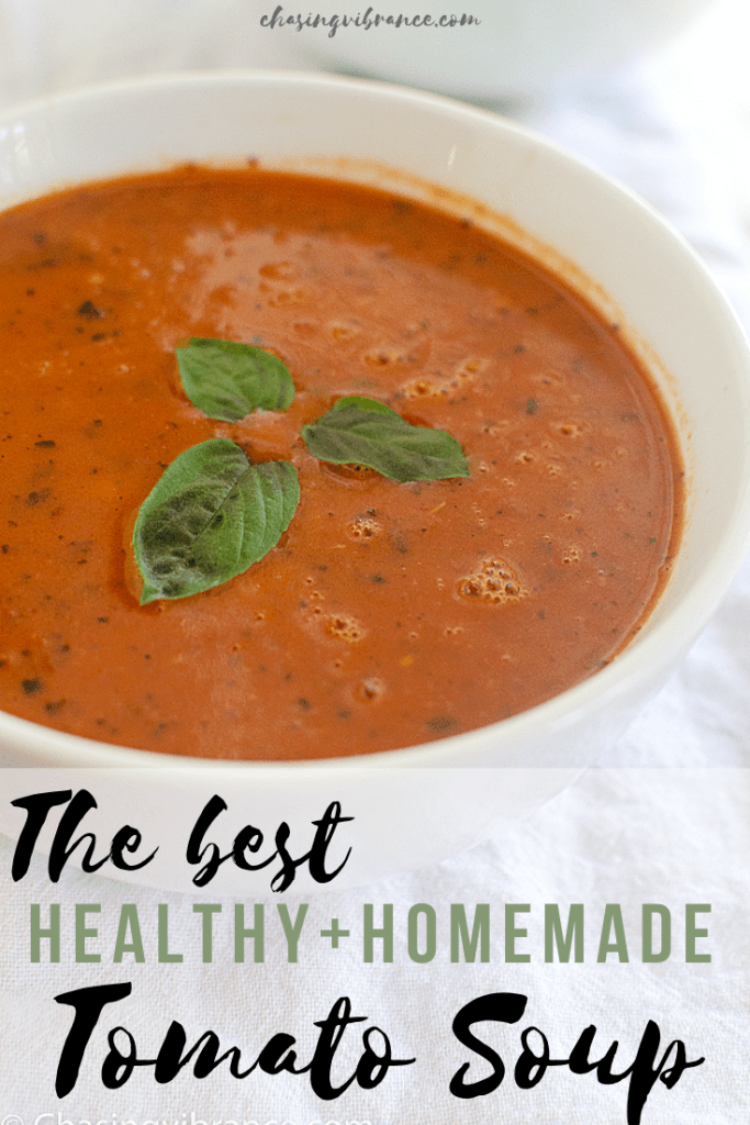 The best healthy + homemade tomato soup text overlay on bowl of tomato soup with basil