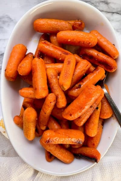 Honey roasted carrots in a white dish