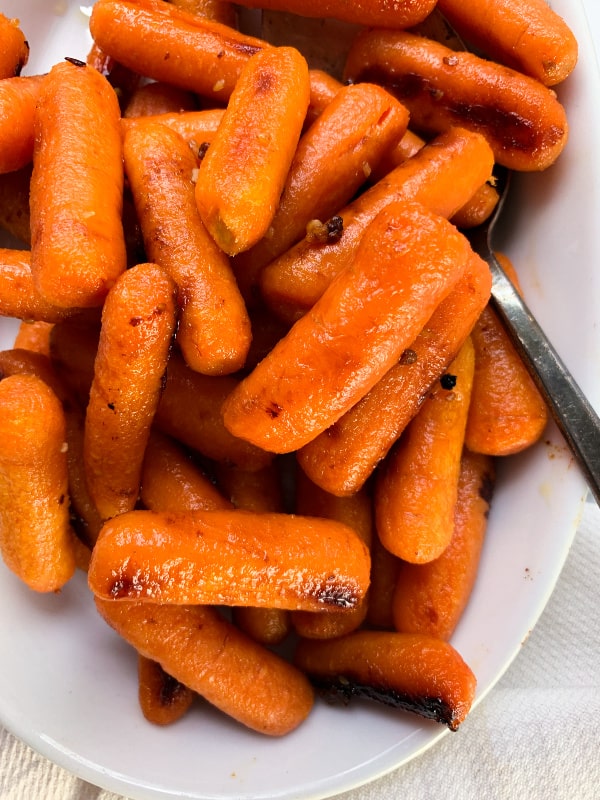 close up of roasted carrots with garlic and honey