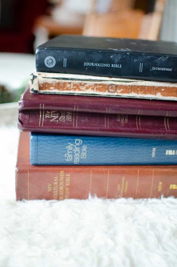stack of colorful bibles on a fuzzy blanket