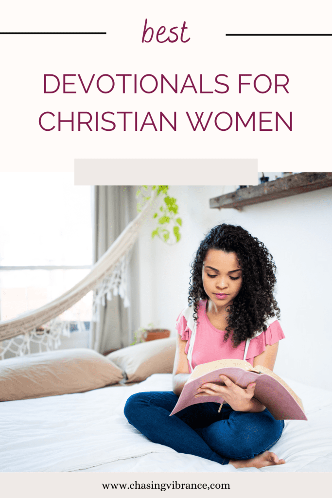 young woman in pink top sits on bed with bible open. Top portion of the photo reads best devotionals for christian women. 