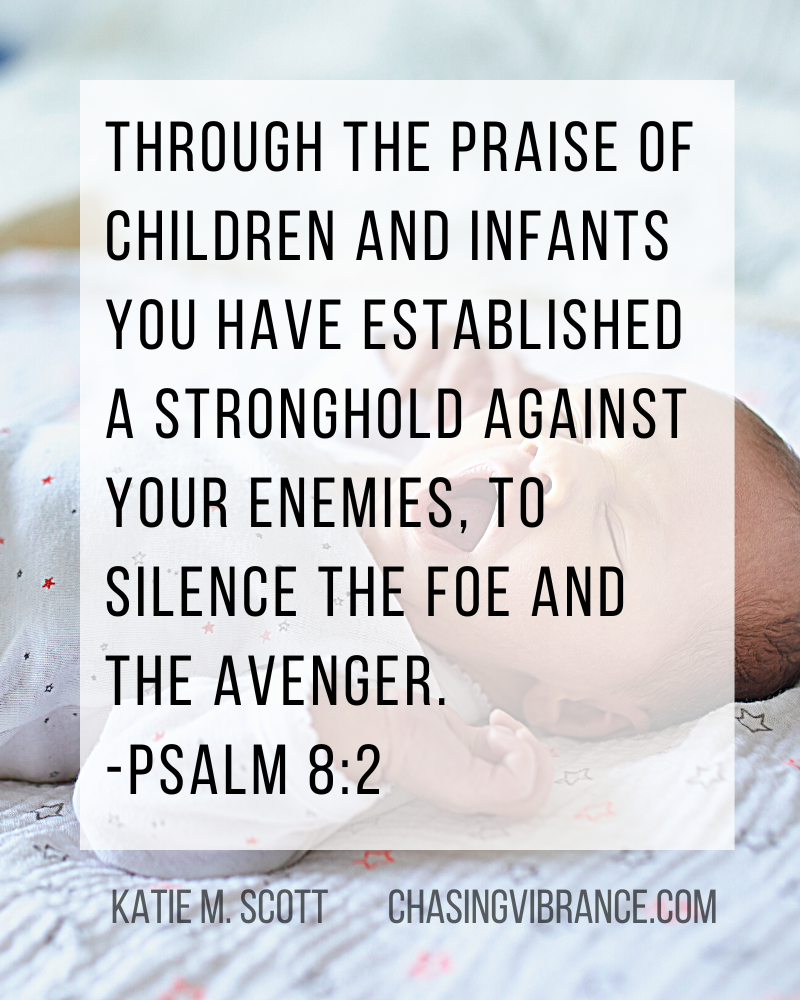 infant lies on soft blanket in a small onesie with mouth open in a yawn or cry. Text overlay is Bible Verse Psalm 8:2