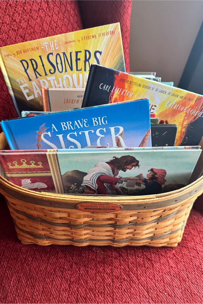book basket of christian children's books for family devotions sitting on red chair