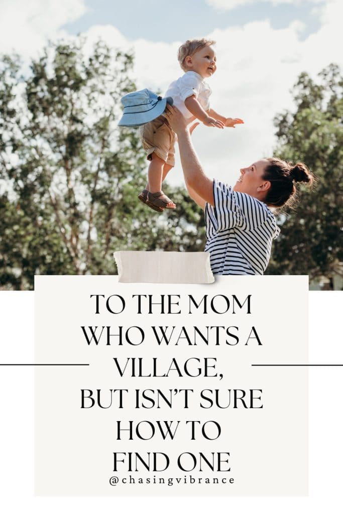 mom holds her toddler up in the air with trees in the background. Note taped to the image reads "to the mom who wants a village, but it isn't sure how to find one
