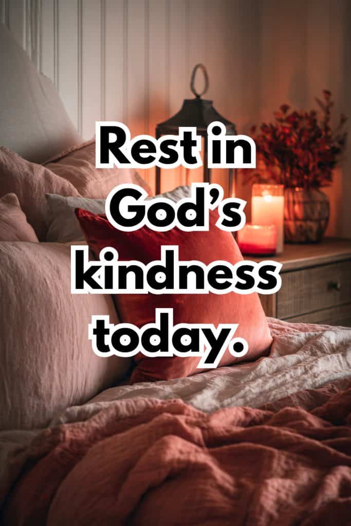 Cozy bed with blush and rose comforters and lots of texture and rose gold light with text overlay "Rest in God's kindness today."