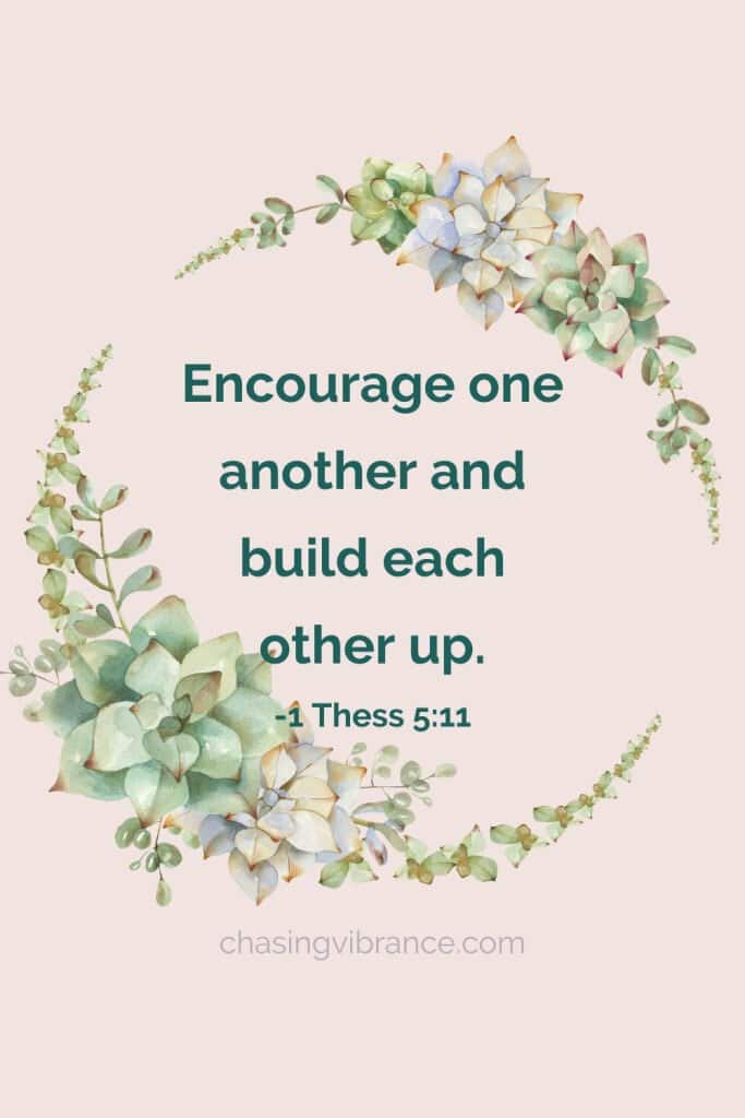 short encouraging bible verse from 1 Thessalonians 5:11 on tan background with succulent wreath surrounding text